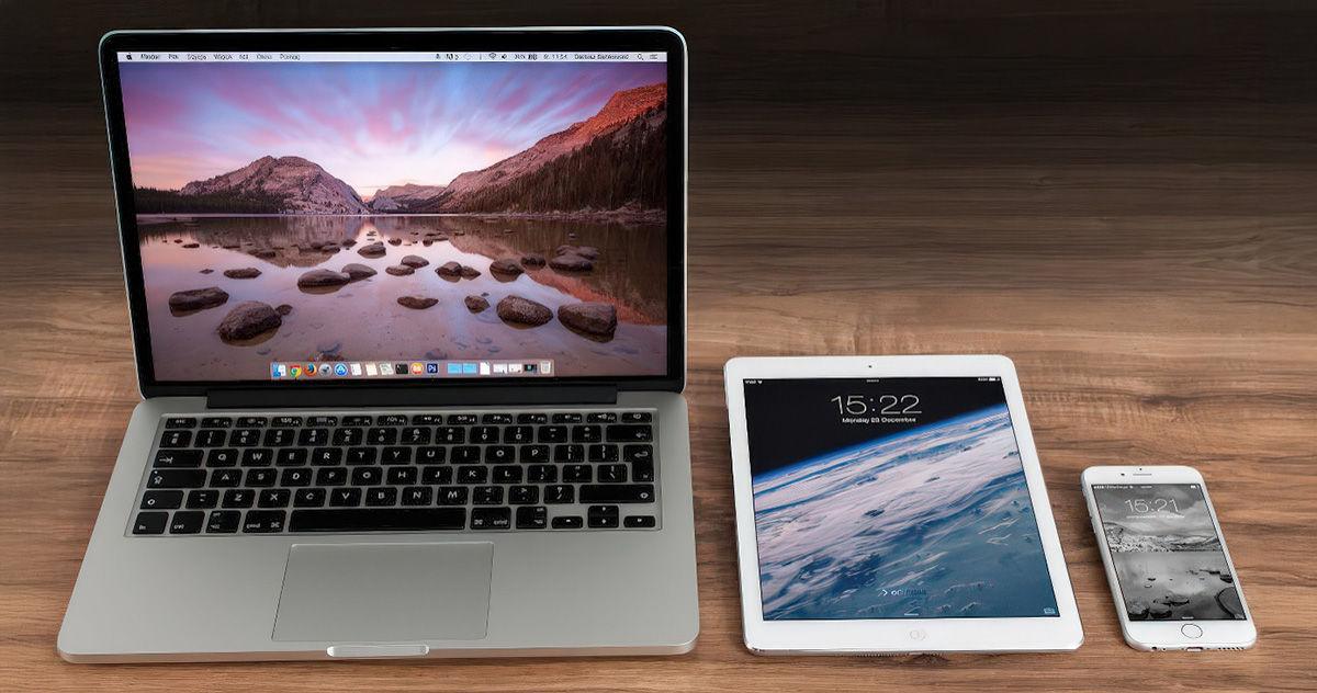 Apple laptop, iPad, and iPhone