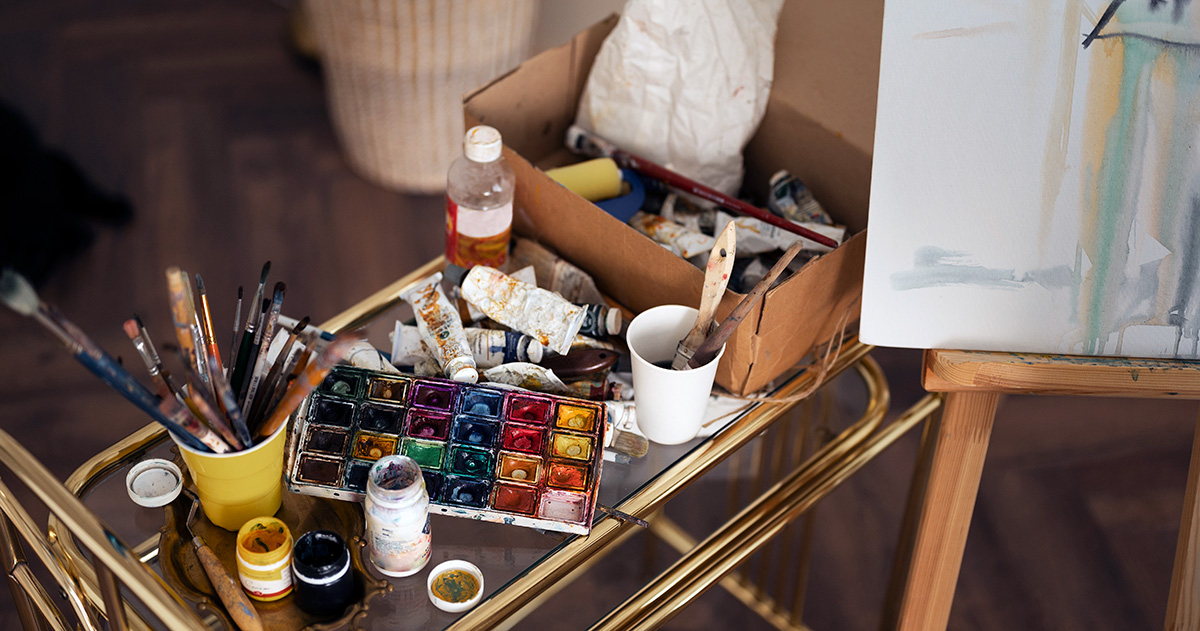 Artist's watercolor supplies in the midst of painting